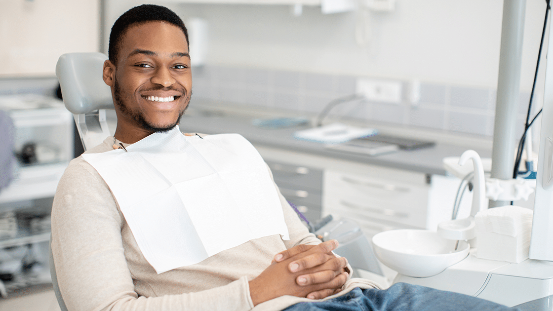 Man In Tan Smiling